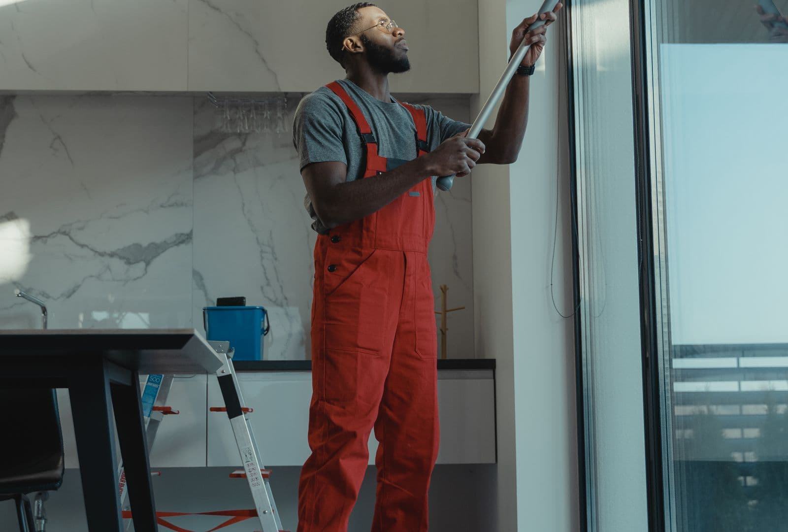 A professional cleaning a window to a clear, streak-free shine